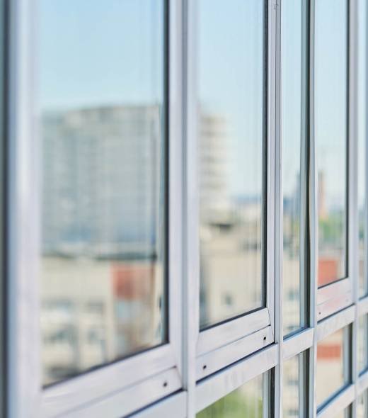 PVC windows on facade of skyscraper. Plastic double glazed windows. Building exterior.